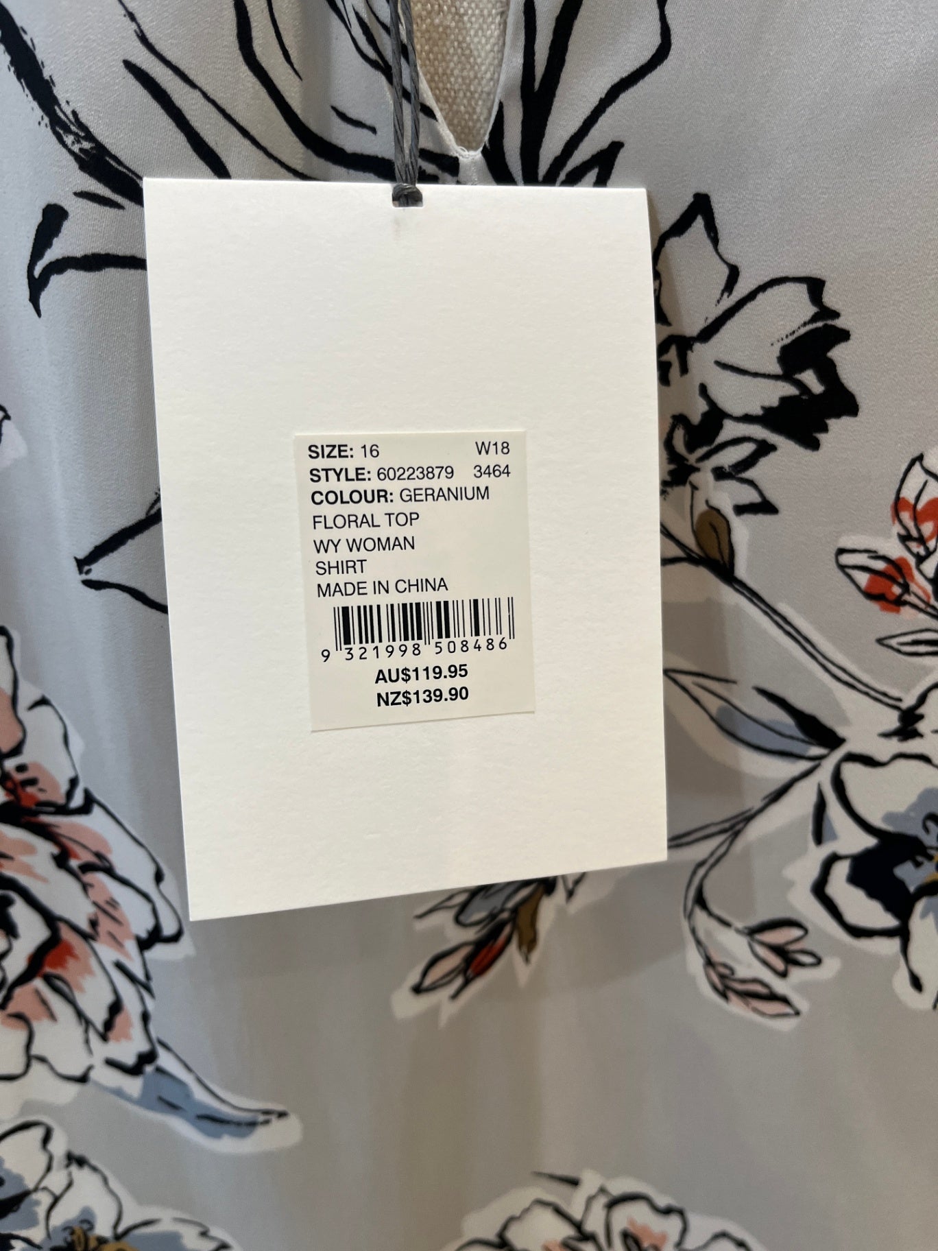 Witchery Blouse Geranium (light pink and black pattern on a white background)