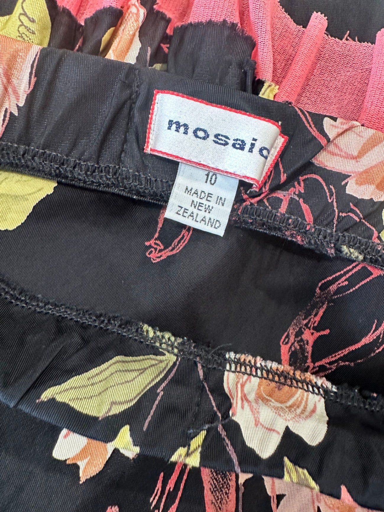 Mosaic - Made in New Zealand - Vintage Skirt - Size 10 - Black with pink, green, and white floral pattern