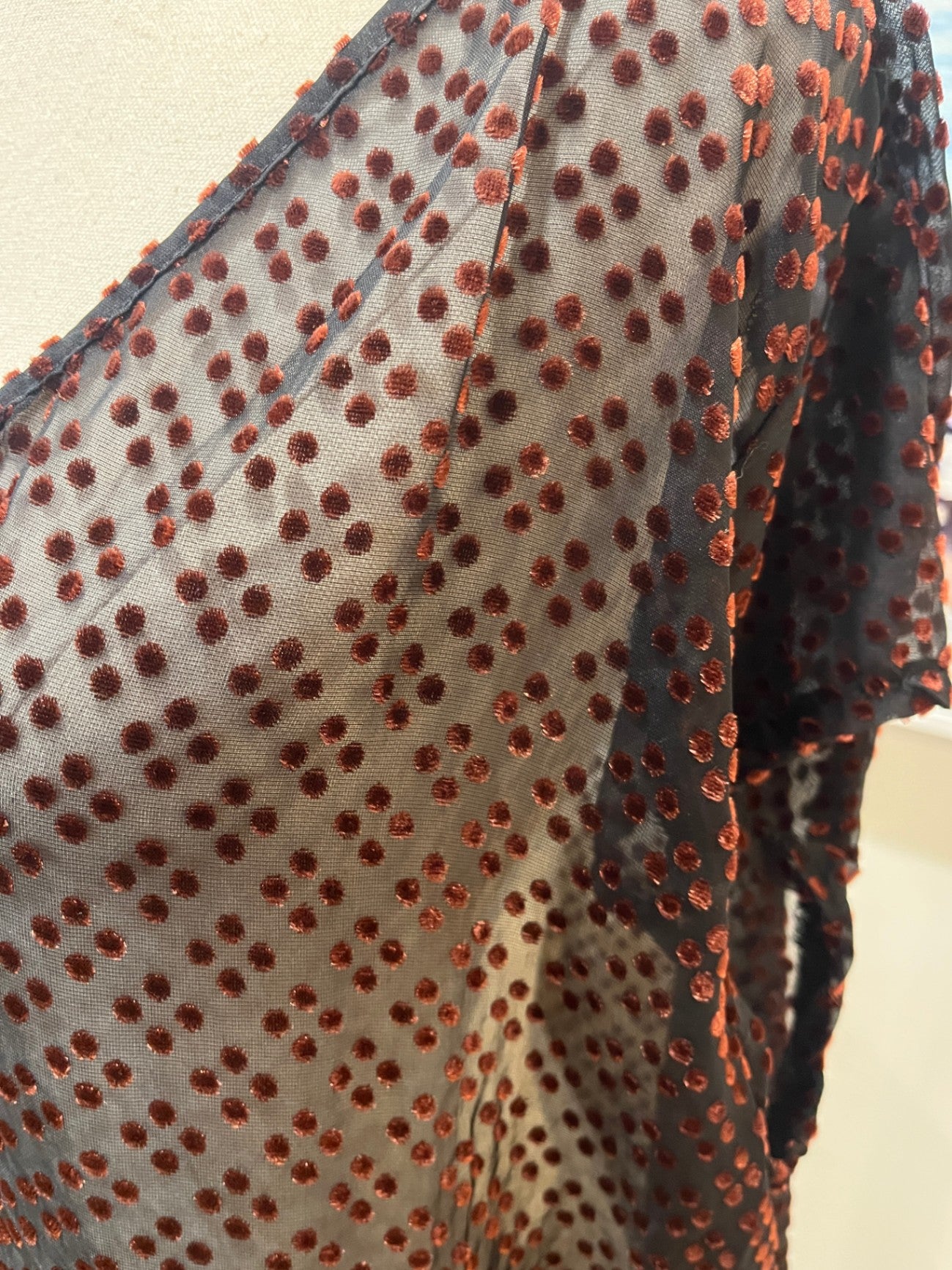 Nes Top Black with reddish-orange dots