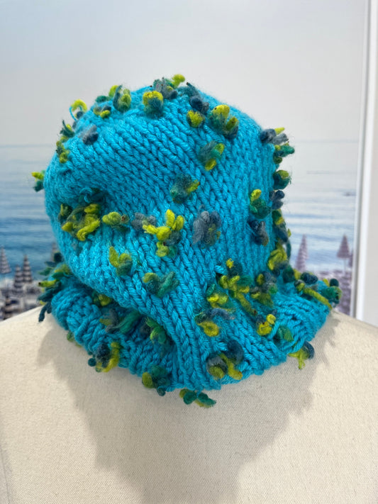 Teal Knitted Beanie with Green Tufted Accents
